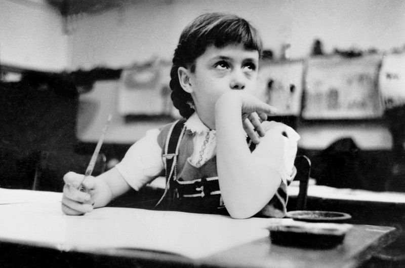 Young girl seated at desk in classroom in Chicago, Illinois. 